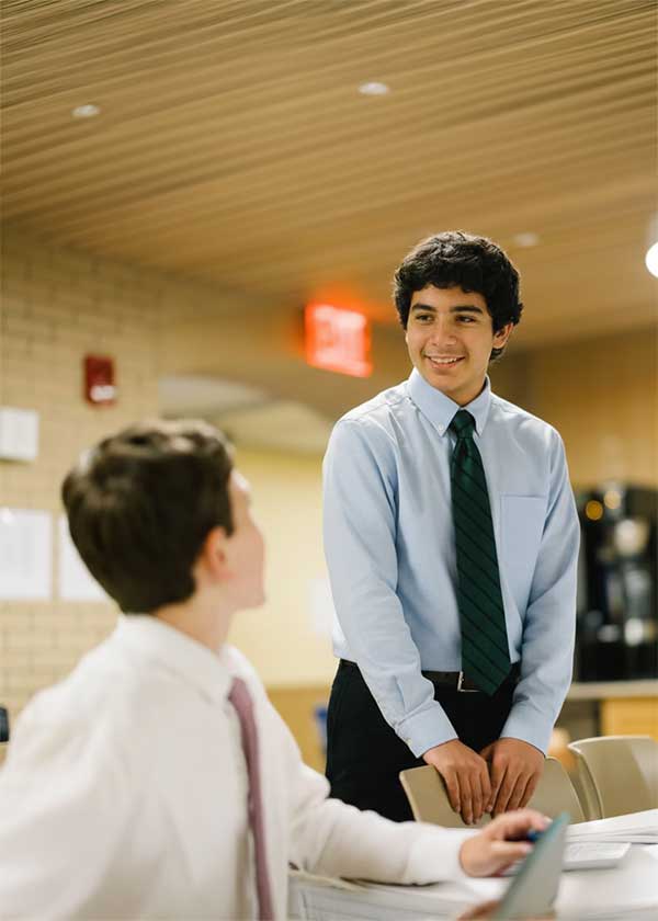 Students talking to each other in dining hall
